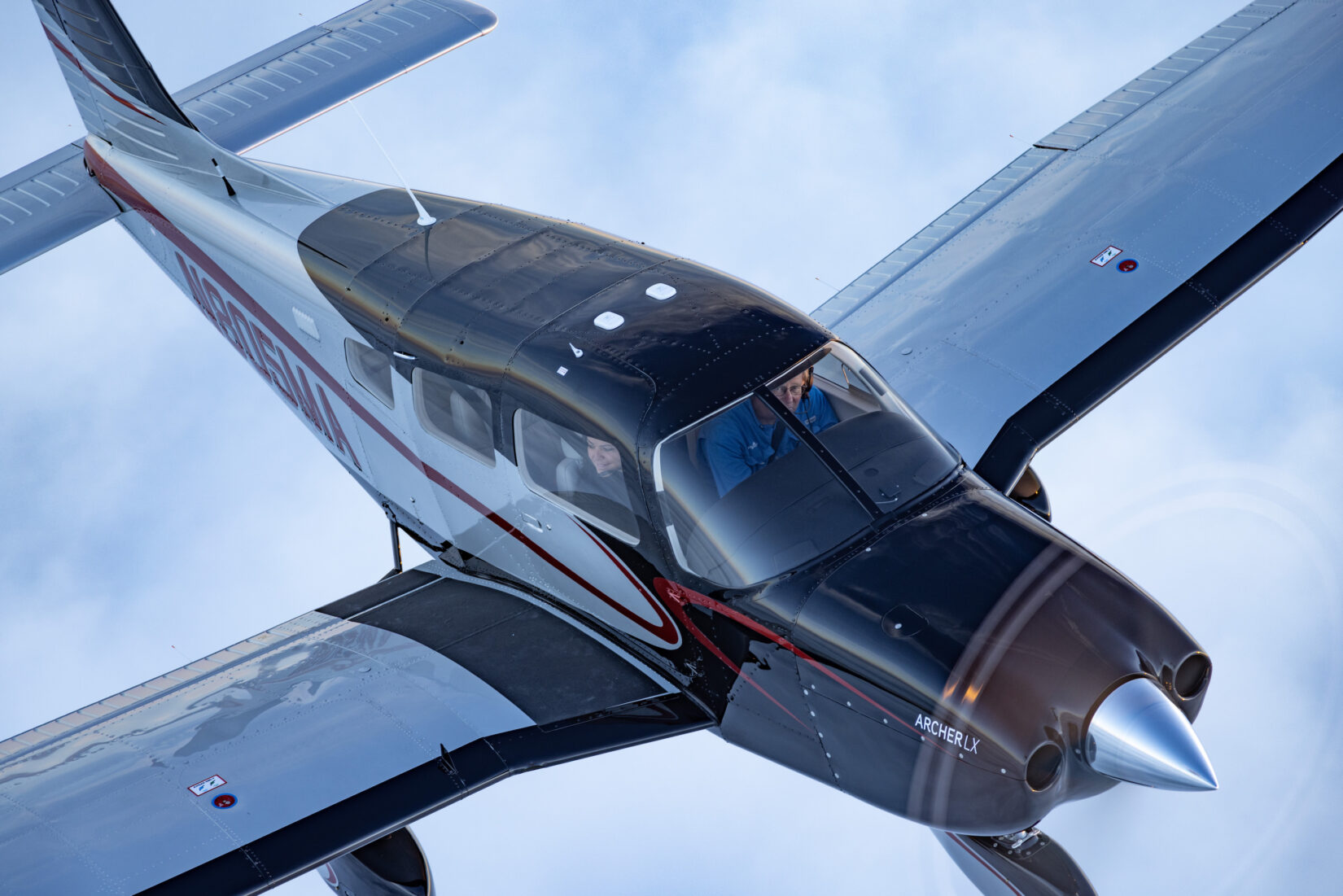 Piper Aircraft Archer LX Personal Aircraft flying through the clouds