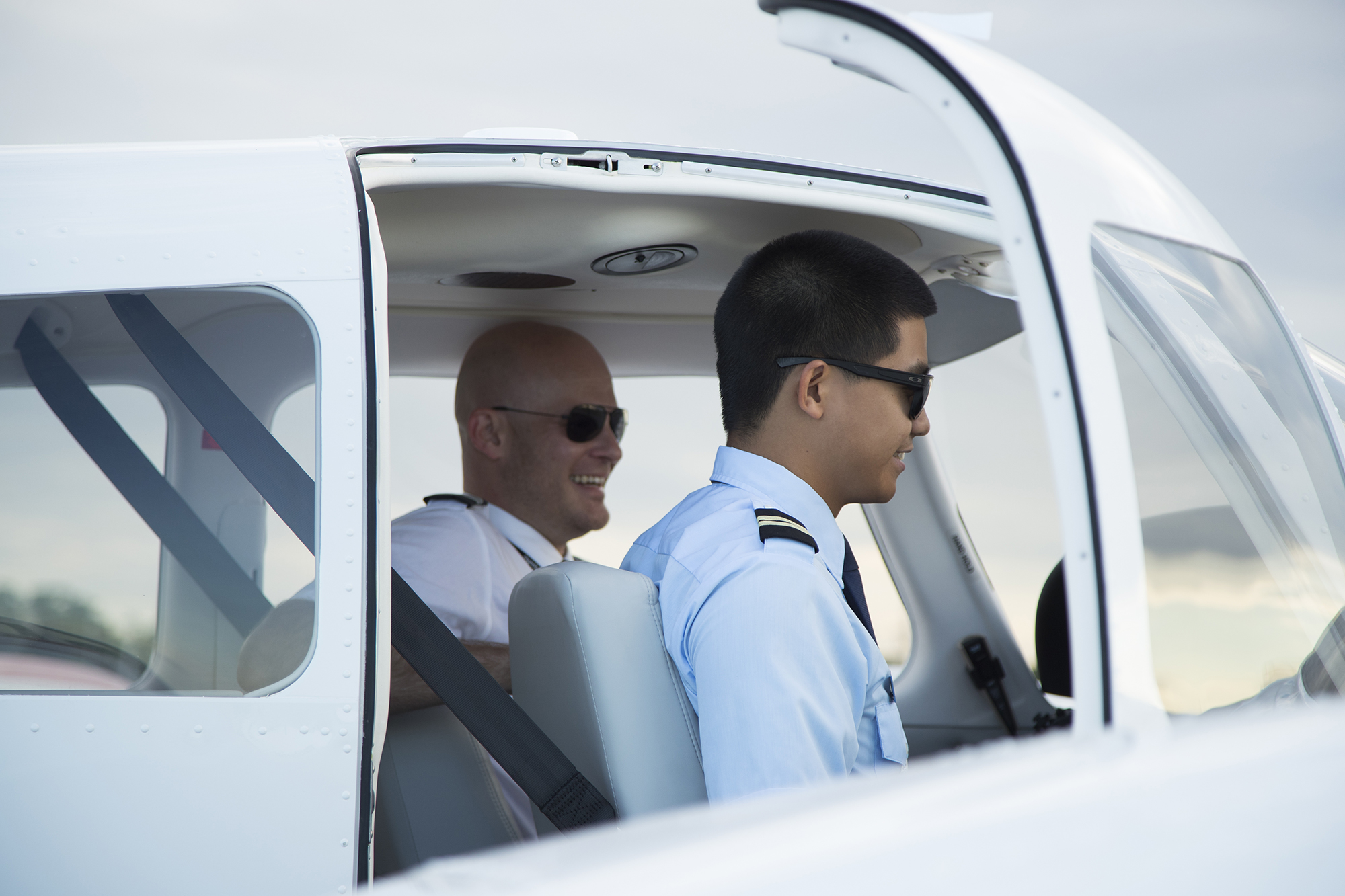 Flight training student and teacher in a cockpit