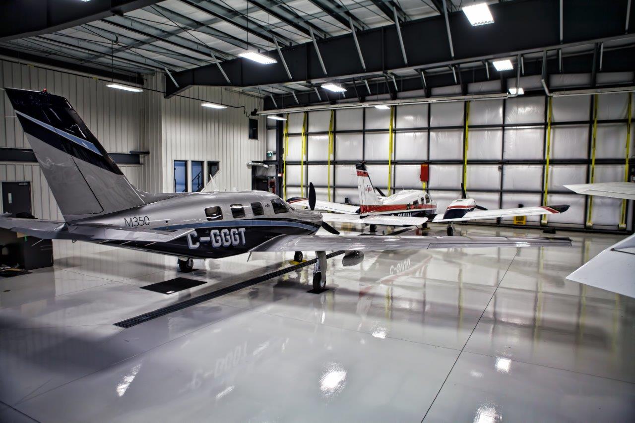 M350 and Seneca inside of a hangar