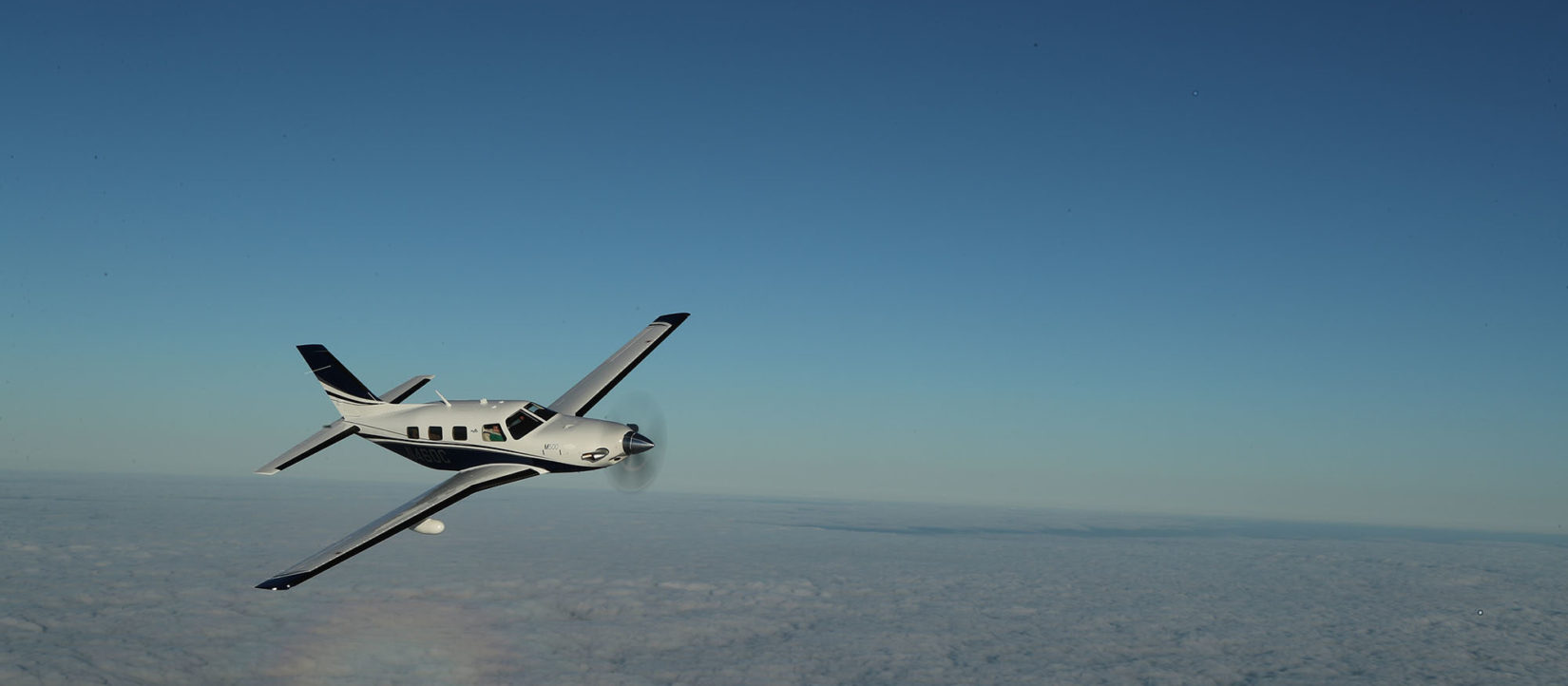Piper Aircraft fleet flying in the sky