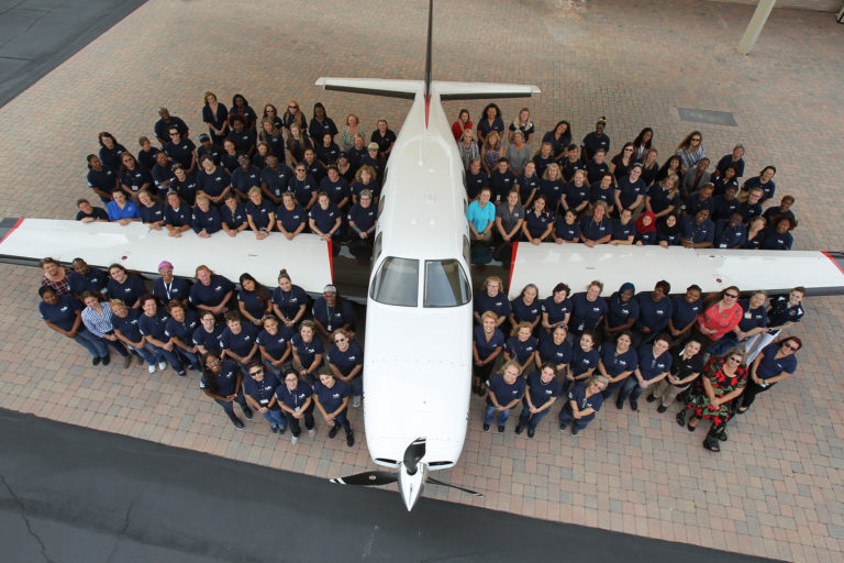 Women of Piper beside a M350