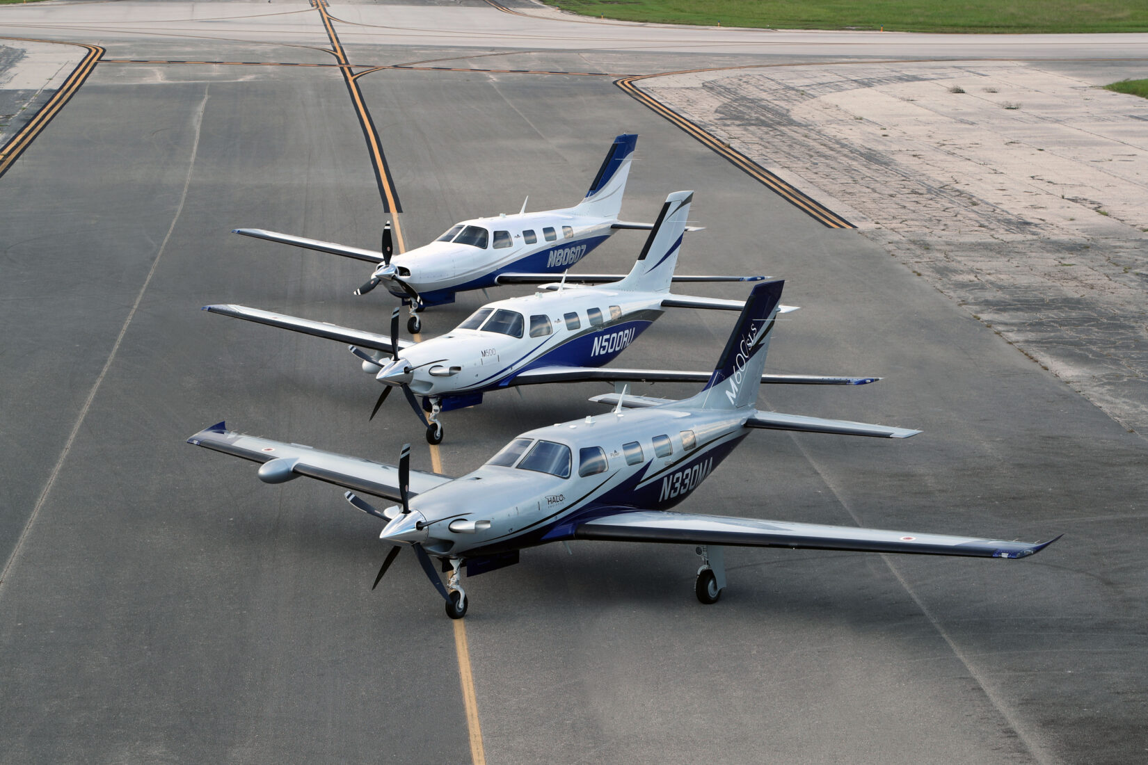 Line of the M Class Piper aircraft on a tarmac