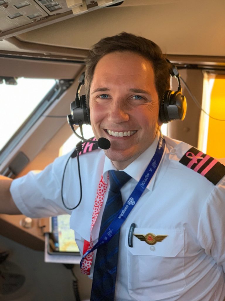 Captain Joe smiling in cockpit of plane