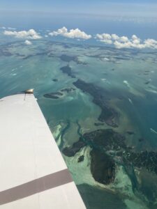 A view of the ocean taken from a Piper aircraft by Paige Bishop.
