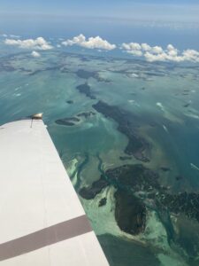 A view of the ocean taken from a Piper aircraft by Paige Bishop.