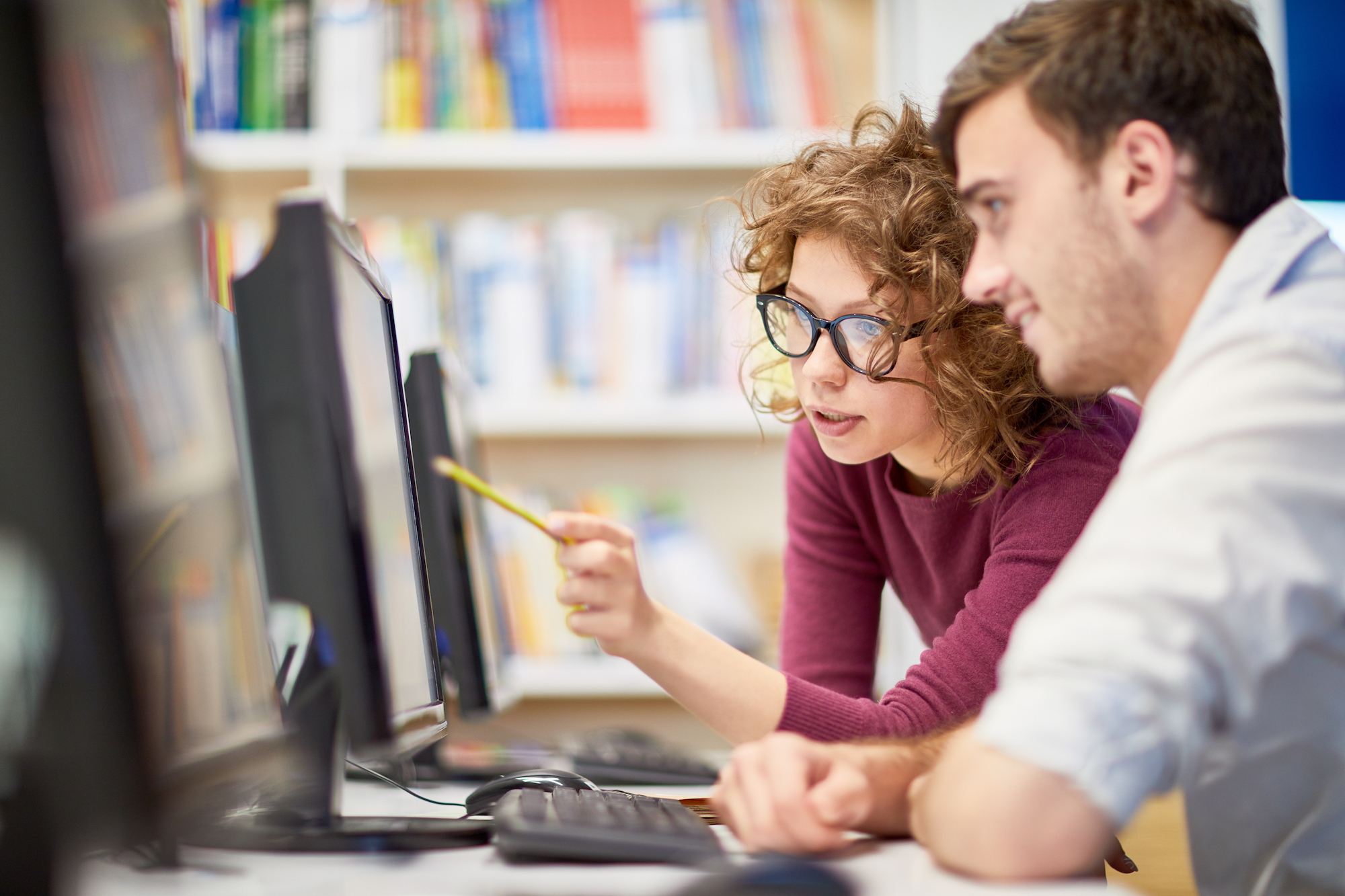 Students researching flight schools online