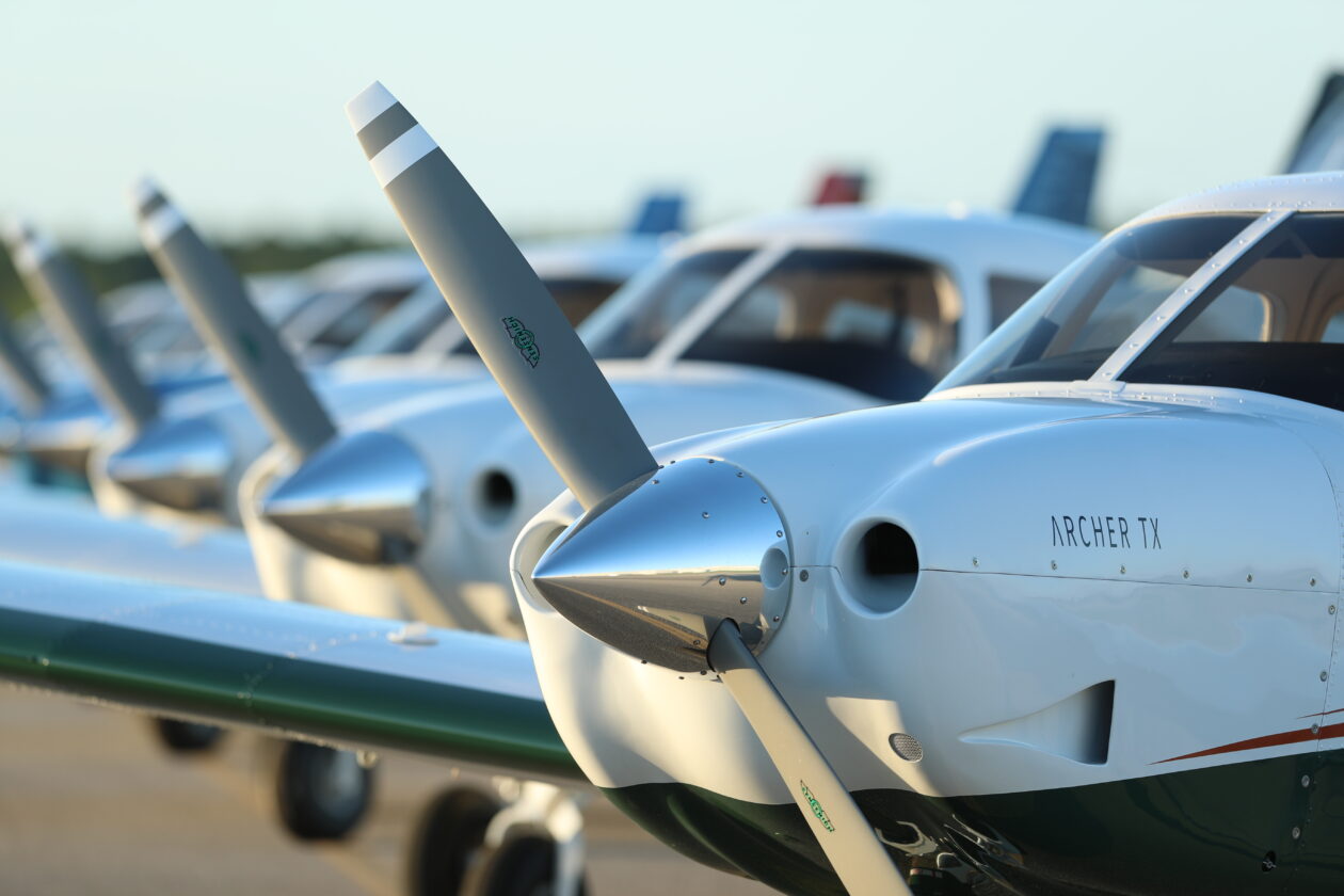 A fleet of Piper Archer trainers, a popular choice for flight schools.