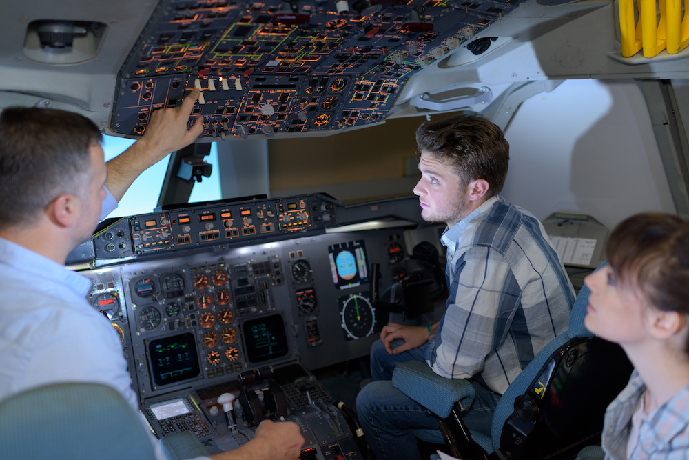 Flight students learning about aircraft controls