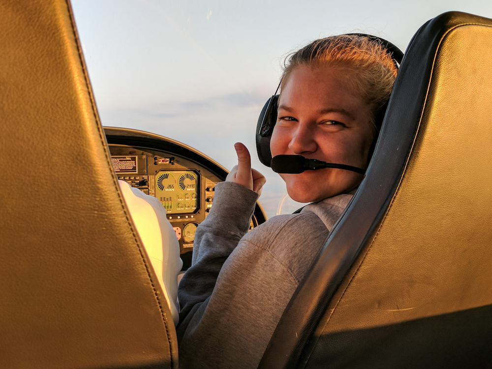 Young woman in an aircraft training to become a pilot