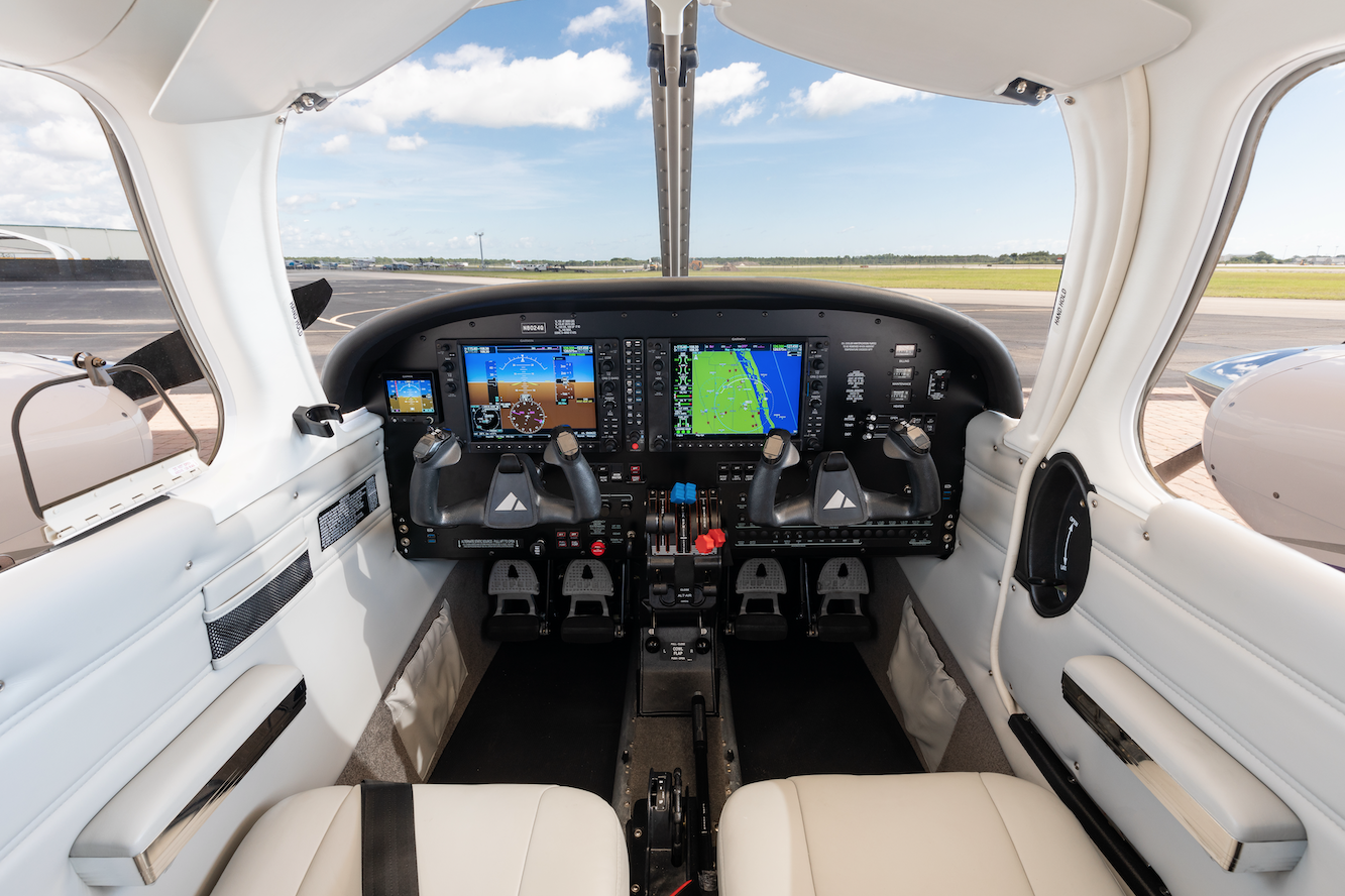 Parts of an Airplane: What Every Flight Student Should Know 3 Interior view of the Piper Seminole cockpit featuring dual yokes, Garmin G1000 avionics displays and flight control panels.