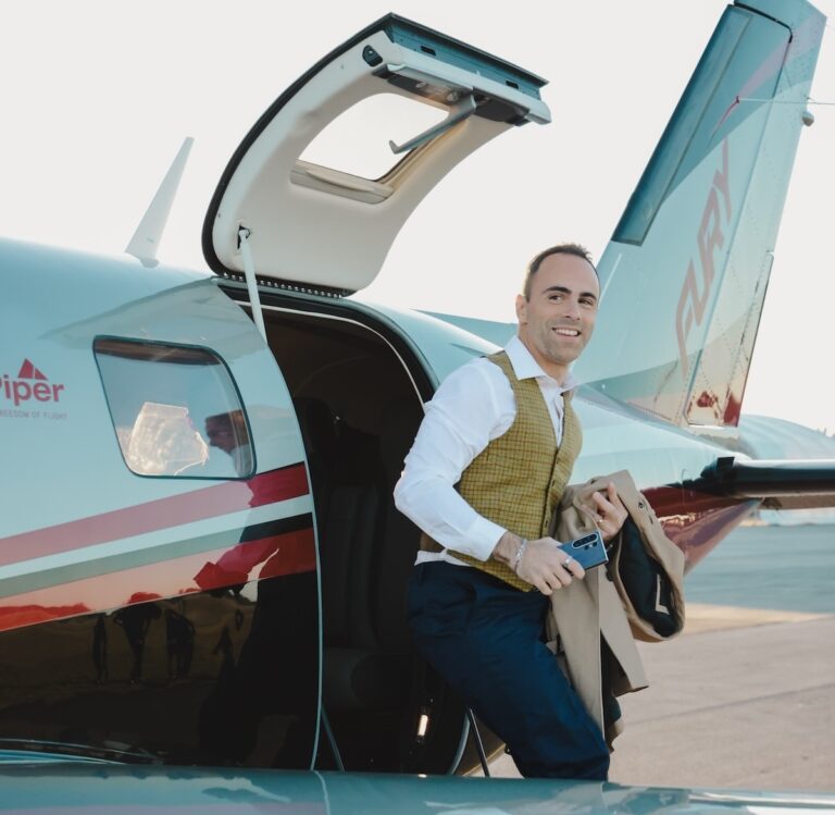 Man exiting a Piper M700