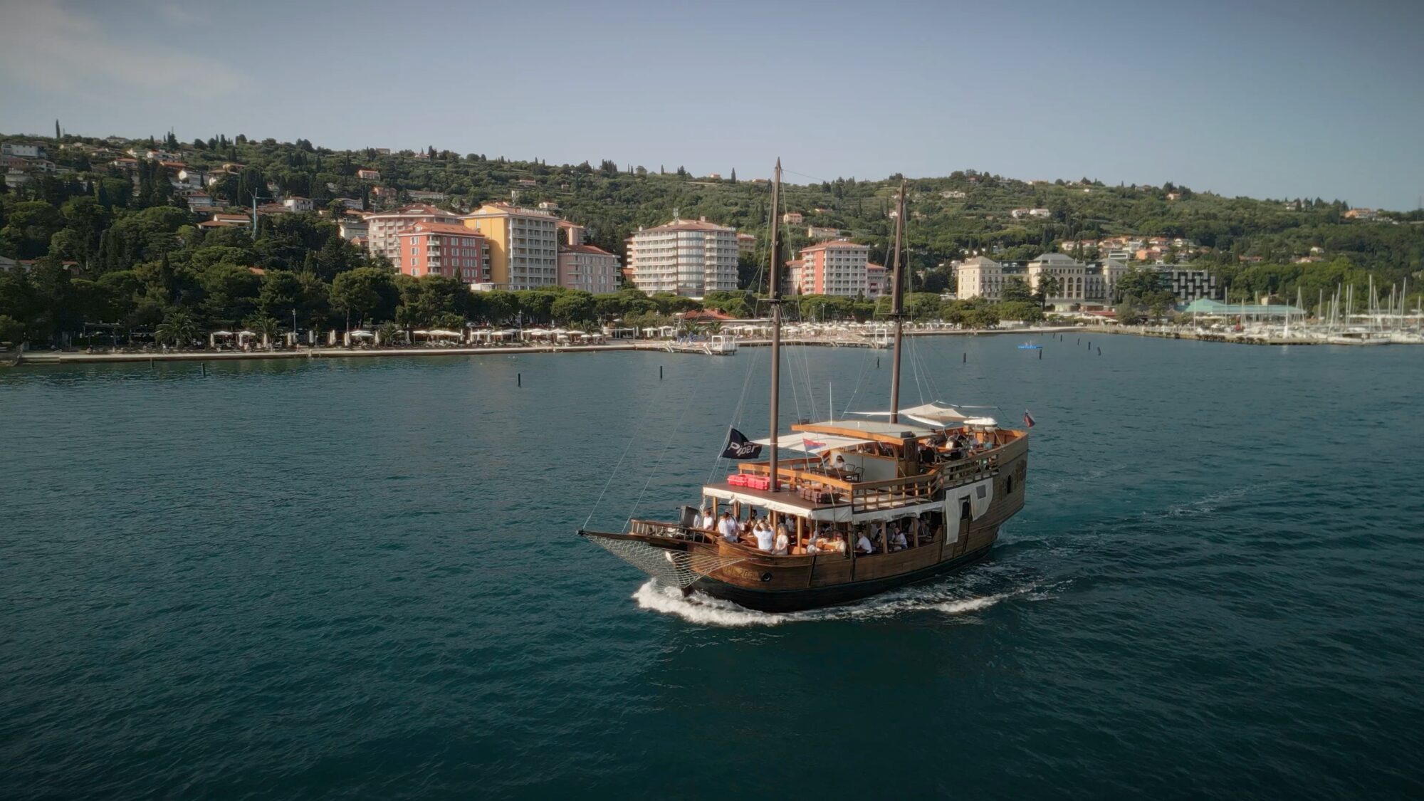  A chartered wooden boat carrying Piper Fly-In guests sails along the Slovenian coast near Portorož.