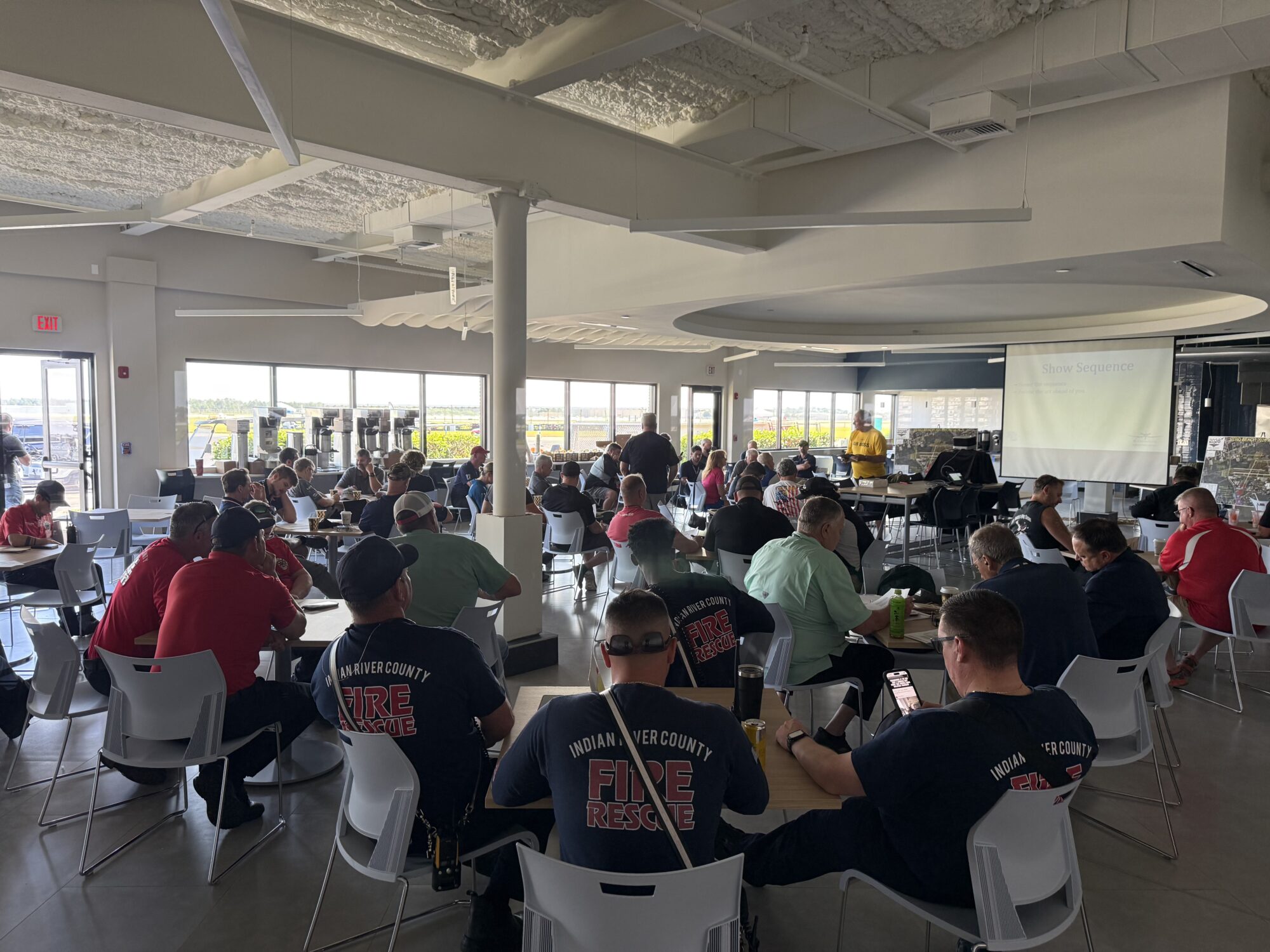 Piper Aircraft employees and Indian River County Fire Rescue members gather for a meal.